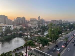 a view of a city with a river and buildings at A luxury apartment fully nile view -Downtown Cairo in Cairo