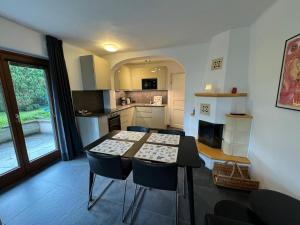a kitchen with a table and chairs in a room at Haus Vera in Zell am See