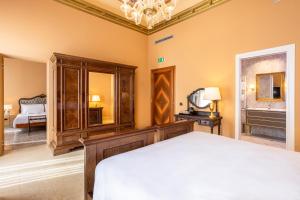 A bed or beds in a room at Antico Portego