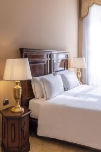 A bed or beds in a room at Antico Portego