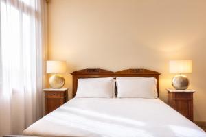 A bed or beds in a room at Antico Portego