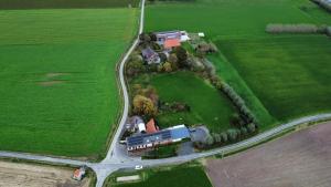 an aerial view of a house in a field at B&B Herberg Boerenhol in Poperinge