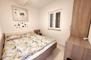 a bedroom with a bed and a window at Spacious 3 Bedroom Apartment 50m from Sea 2 Bathrooms 2 Terraces Near Beach in Privlaka