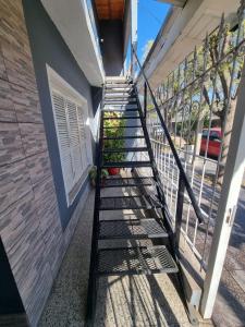 a staircase leading up to a house at Los Abuelos Apart in General Pico