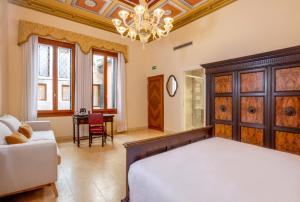 A bed or beds in a room at Antico Portego