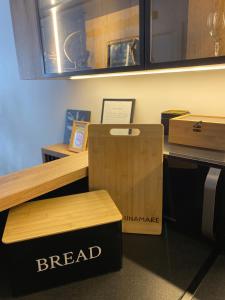 a break room with a bread counter with a box at Apartment Unamare in Belgrade