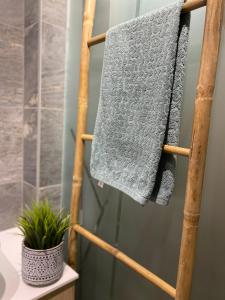 a towel rack in a bathroom with a towel at Apartment Unamare in Belgrade +59 photos