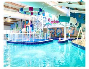 an indoor water park with a water slide at WestSands Caravan in Selsey