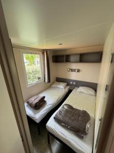 Cama o camas de una habitación en Mobil-home bord de mer
