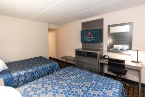 Postel nebo postele na pokoji v ubytování Coratel Inn & Suites by Jasper Mankato