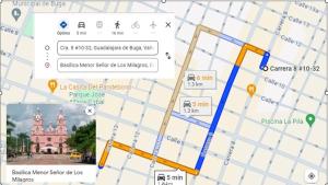 a screenshot of a map with directions to a church at comodo apartamento central in Buga