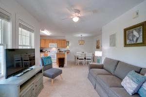 a living room with a couch and a dining room at Buxton Vacation Rental with Shared Canal Access! in Buxton