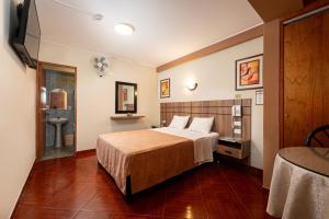 Cama ou camas em um quarto em Hotel Bohemia