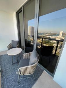 a room with chairs and a table on a building at Canvas in Miami