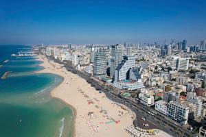 an aerial view of a beach and the ocean at The David Kempinski Tel Aviv in Tel Aviv