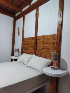 Giường trong phòng chung tại puntacanoas bungalows