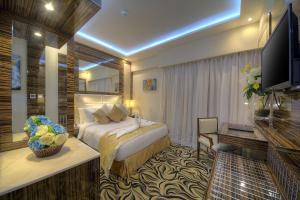 Krevet ili kreveti u jedinici u objektu Orchid Vue Hotel