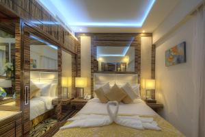 Krevet ili kreveti u jedinici u objektu Orchid Vue Hotel