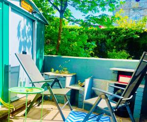 a group of chairs and tables on a patio at 4 Market Street in Bantry
