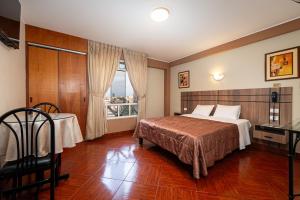 Postel nebo postele na pokoji v ubytování Hotel Bohemia + 37 fotografií