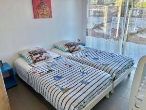 Postel nebo postele na pokoji v ubytování La Villa KEROMER