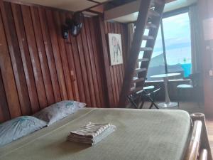 Postel nebo postele na pokoji v ubytování MLK Bamboo Beachhouse + 37 fotografií