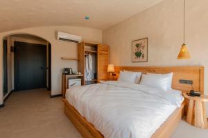 מיטה או מיטות בחדר ב-Unsal Hotel