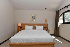 Postel nebo postele na pokoji v ubytování Unsal Hotel