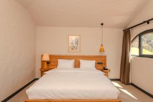 Postel nebo postele na pokoji v ubytování Unsal Hotel