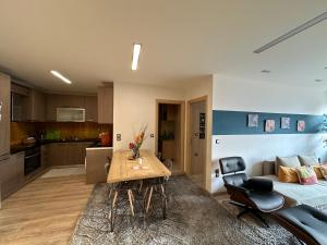 a room with a bed and a table and a couch at URBAN APARTMENT in Amaliás