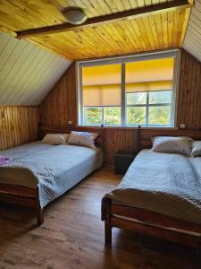 Llit o llits en una habitació de Šauklių pirtelė