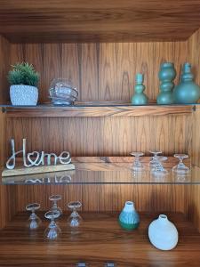 a wooden shelf with glass vases on it at Haus Lieberum Ferienwohnung 1.Etage Balkon in Bad Sooden-Allendorf