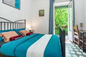 Ένα ή περισσότερα κρεβάτια σε δωμάτιο στο Rosa Rooms