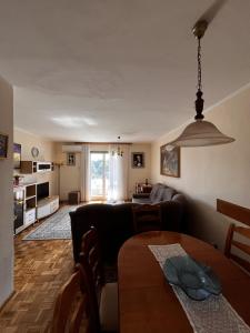 a living room with a couch and a table at Filipo Apartments in Poreč