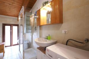 a bathroom with a sink and a shower at Primopiano - Di Vittorio in Sesto San Giovanni +27 photos