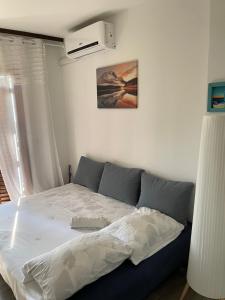 Posteľ alebo postele v izbe v ubytovaní Apartman Hrusta Crikvenica