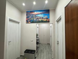 a hallway with a painting hanging on the wall at B&B Mageva Luxury Room in Naples