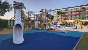 a playground at a resort with a slide at Aquashow Park Hotel in Quarteira