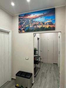 a living room with a large painting on the wall at B&B Mageva Luxury Room in Naples