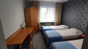 Postel nebo postele na pokoji v ubytování Leśny Zajazd
