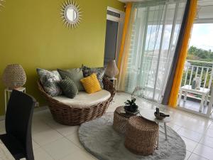 Зона вітальні в Appartement avec vue panoramique de Pointe-à-Pitre