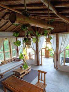 a room with a room with bananas hanging from the ceiling at Cabaña El Ensueño in Santa Rosa de Cabal +13 photos