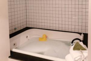 a rubber duck sitting in a bath tub at The Coachman Hotel in South Lake Tahoe