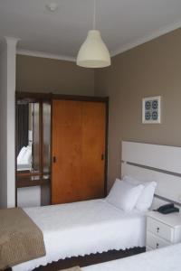 Postel nebo postele na pokoji v ubytování Hotel Chique Aliados