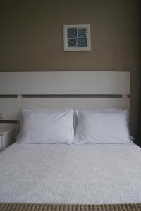 Postel nebo postele na pokoji v ubytování Hotel Chique Aliados