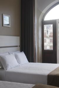 Postel nebo postele na pokoji v ubytování Hotel Chique Aliados