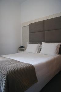 Postel nebo postele na pokoji v ubytování Hotel Chique Aliados