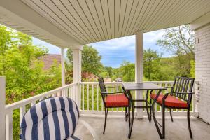 a porch with two chairs and a table and chairs at Charming West Mifflin House - 3 Mi to Kennywood! in West Mifflin