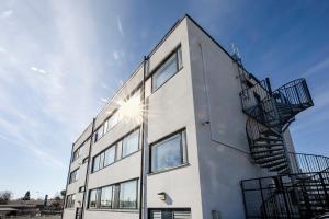 a building with stairs on the side of it at Hotelli Toivola in Kemi