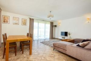 a living room with a couch and a table at Dom Wypoczynkowy Zalesie in Przanowice